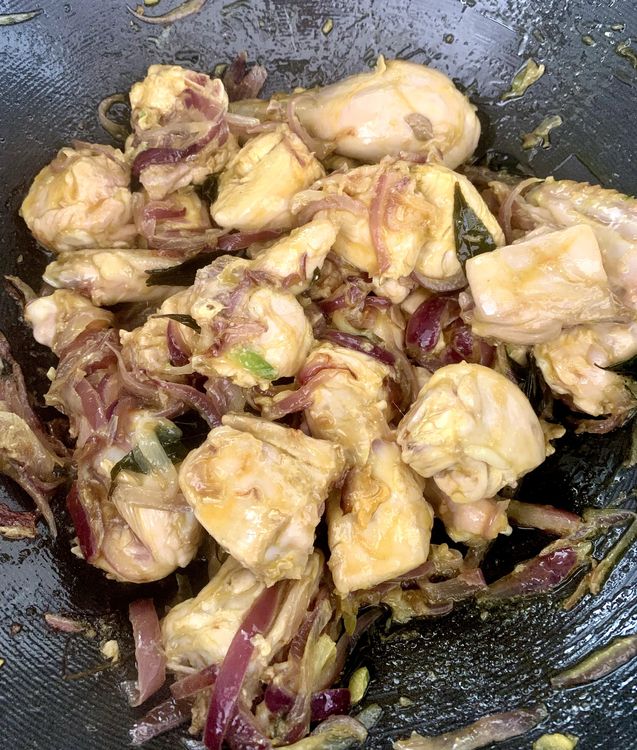 Step 1.2: Add the chicken to the wok and stir until it changes colour