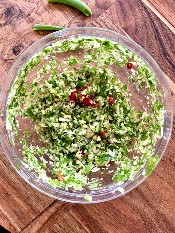 Step 1.1: Use a food chopper to finely chop the lemongrass, shallots, garlic, and red Thai chilli together