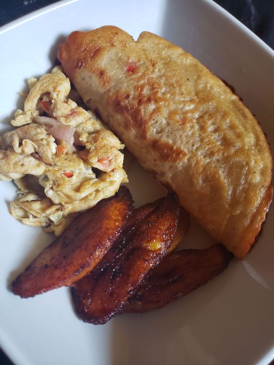 Step 1.3: Using a frying spoon, place the plantain in the oil and let it fry for about a minute or until it turns golden brown