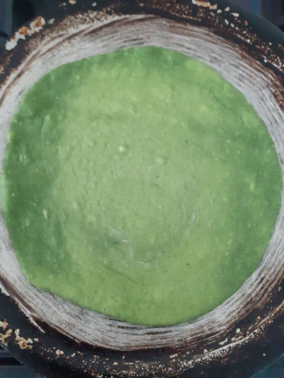 Step 1.2: \>Mix all the dry ingredients in a bowl well \>Pour in the spinach puree and mix well \>Pour in the water bit by bit while kneading \>Add 3 spoonfuls of oil in the dough \>Cover with a clean towel/cling film and let the dough rest for 10-15min \>Divide into balls ready to roll out \>Roll out the balls into fine cirlces(not too thick, not too thin) \>On a medium heated frying pan, cook each side until it is golden brown \>Serve hot with stew of your choice