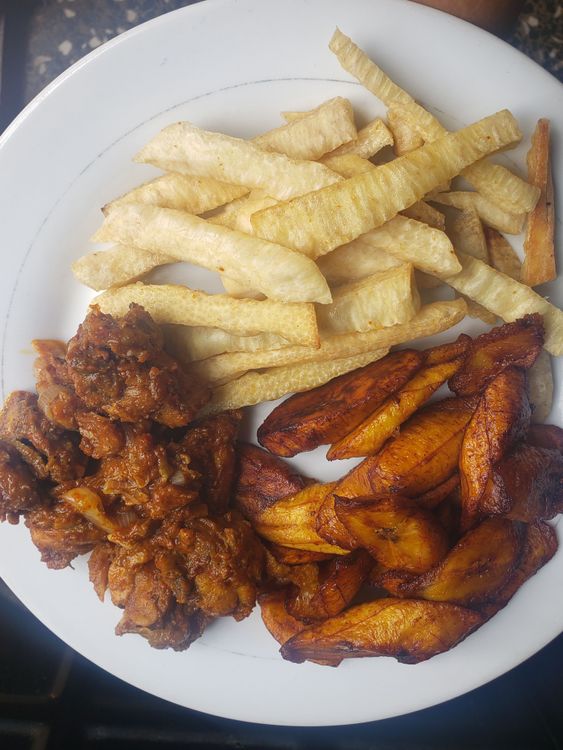 Step 1.5: Using a frying spoon, place the plantain in the oil and let it fry for about a minute or until it turns golden brown