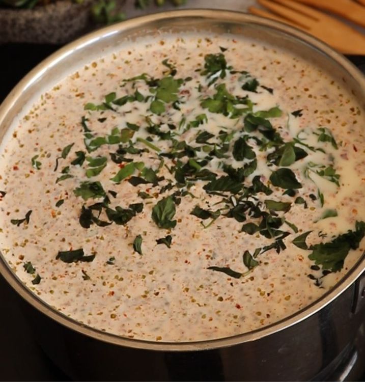Step 1.1: Once the milk boils, add coriander and basil leaves