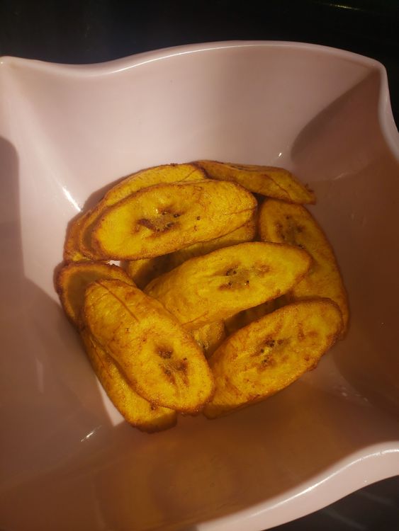 Step 1.1: Using a frying spoon, place the plantain in the oil and let it fry for about a minute or until it turns golden brown