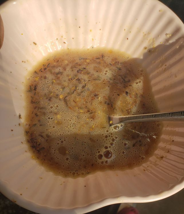 Step 1.1: Then add a pinch of salt, a pinch of pepper, a pinch of seasoning cube and garlic (preferably grated) and thyme leaves to the eggs and whisk