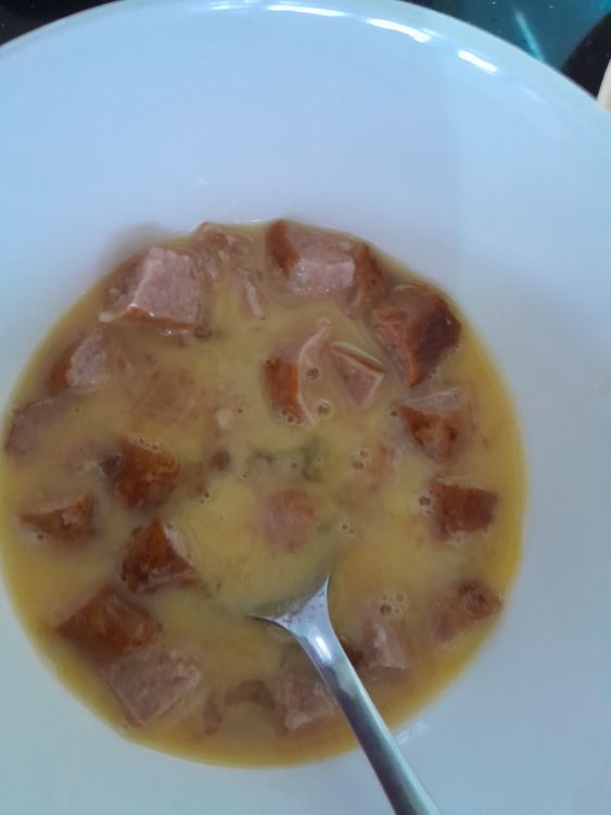 Step 1.1: In a bowl, whisk 2 eggs each and 2 chopped sausages