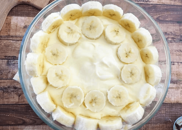 Step 2.1: Fill the center with whipped cream and fill spaces between the top layer of pound cake with more whipped cream
