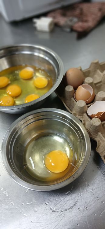 Step 1.1: In a mixing bowl, crack all five eggs