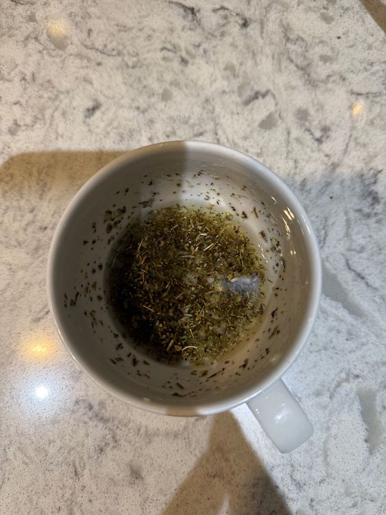 Step 1.1: Drain the water and add oil, garlic, mixed dried herbs, salt, and pepper