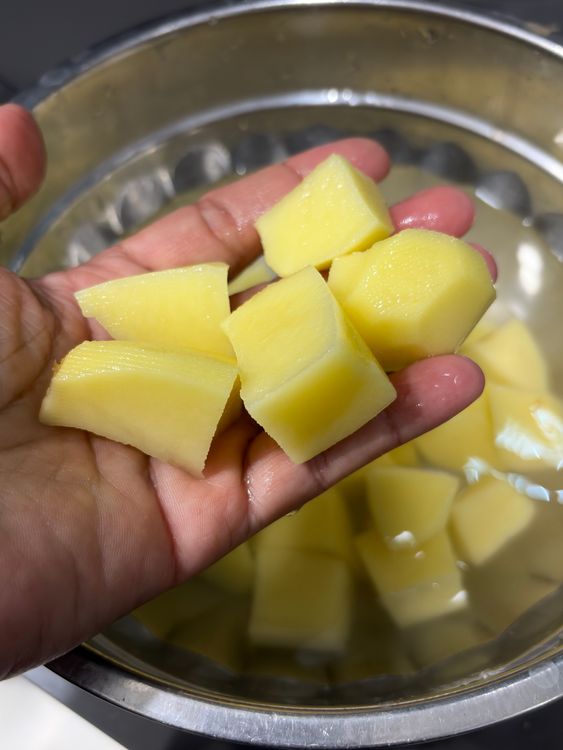 Step 1.1: Peel, wash, and cut the potatoes into cubes or halves