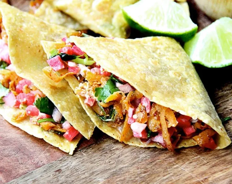 Step 1.1: Remove the pan from the oven, and fold each tortilla in half