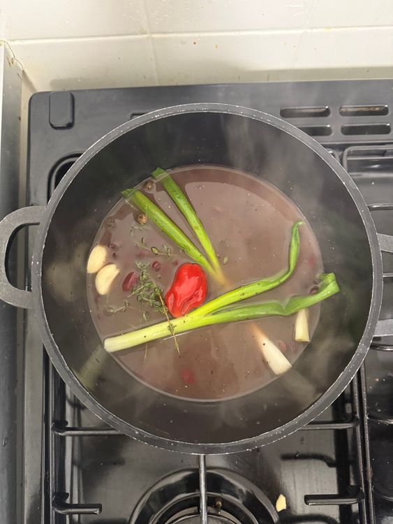 Step 3.1: In a pan, combine kidney beans (undrained), coconut milk, thyme, pimento, all-purpose seasoning, spring onions, garlic, scotch bonnet, salt, black pepper, and water