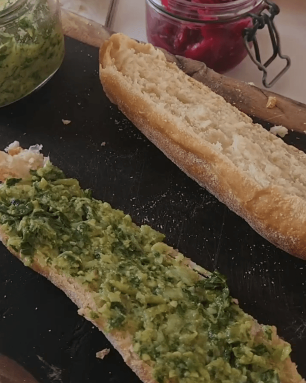 Step 3.1: Spread a generous layer of pea basil pesto on each ciabatta roll's bottom half