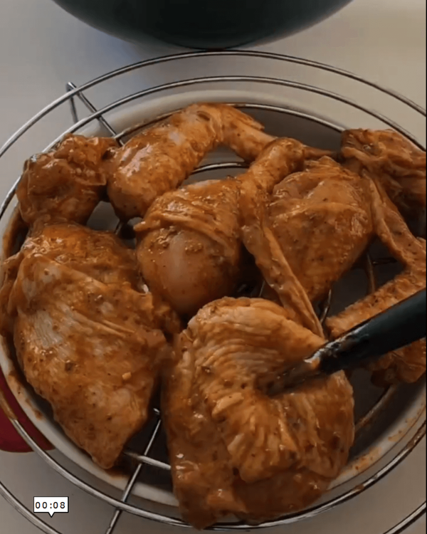 Step 1.1: Remove the chicken from the marinade, allowing excess marinade to drip off