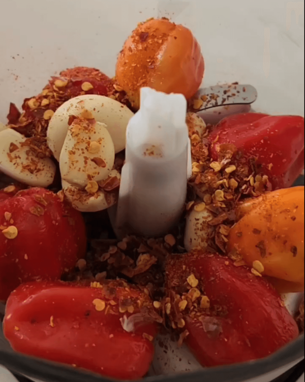 Step 1.1: Place the chillies, garlic, and onions in a food processor