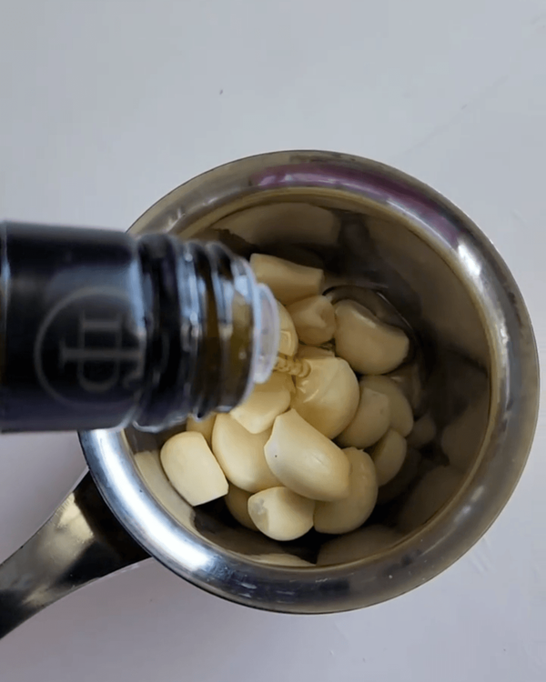 Step 1.1: Peel the garlic cloves and cover them in olive or vegetable oil