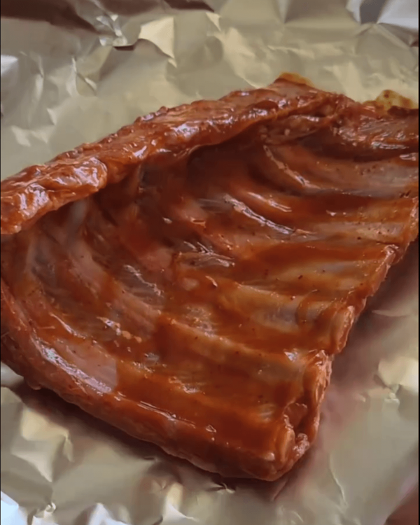 Step 2.1: Wrap the marinated ribs tightly in foil, sealing the edges to lock in moisture
