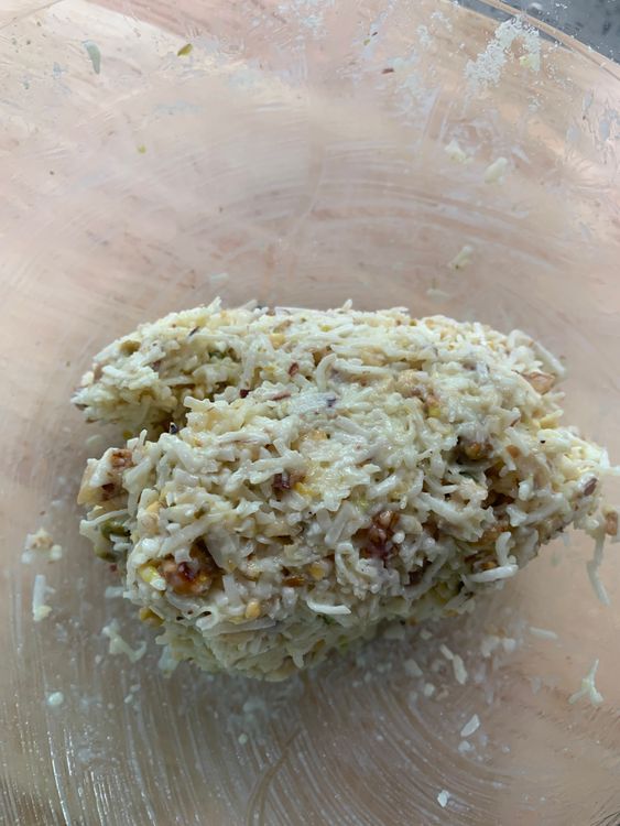 Step 2.1: Gradually add milk, mixing until you achieve a soft, cohesive mixture