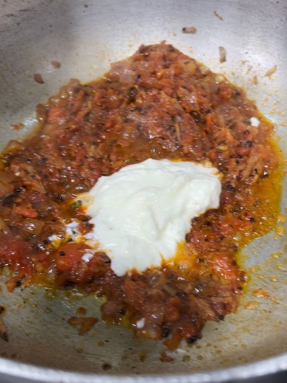 Step 2.2: Add grated tomatoes and cook until soft and oil begins to separate