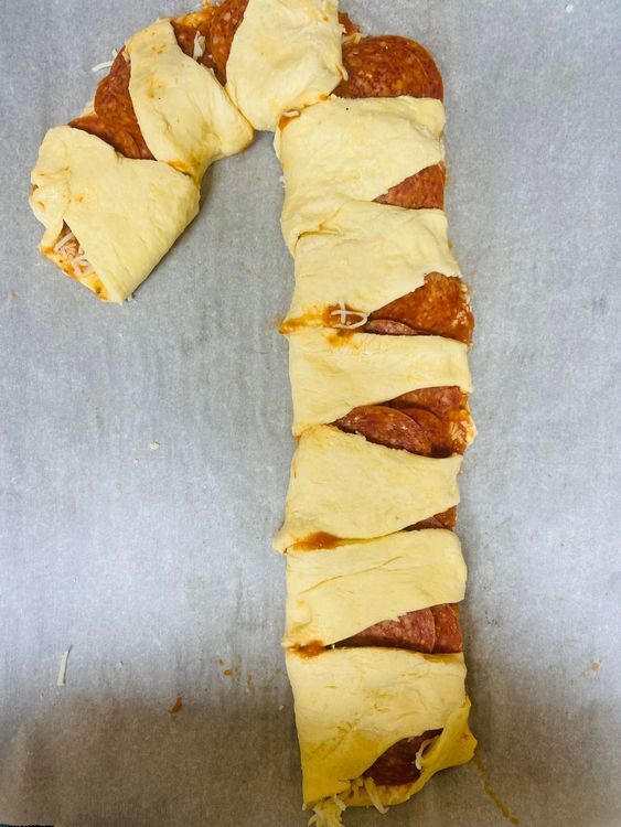 Step 1.1: Shape the Candy Cane: Starting from one long edge, carefully roll the dough into a log