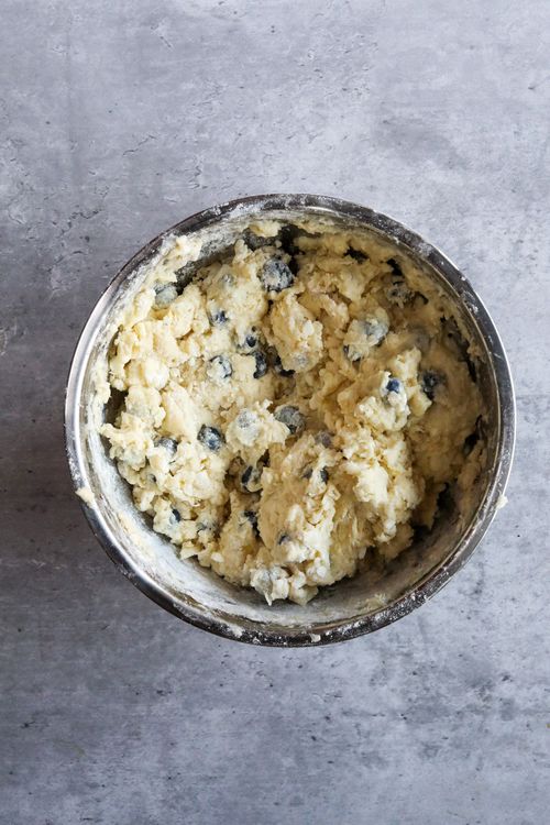 Step 1.1: Pour the wet ingredients over the dry ingredients and gently fold and mix with a spatula until all contents stick together