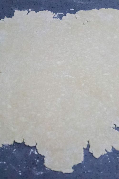 Step 2.1: Roll out the short crust pastry and place it on a sheet pan or round baking sheet