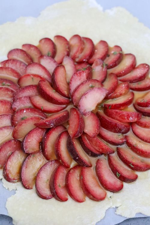 Step 2.1: Arrange the plums on the pastry