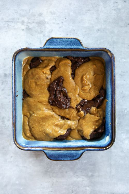 Step 6.1: Place alternating dollops of each batter in the pan, rotating the pan 90 degrees for each layer
