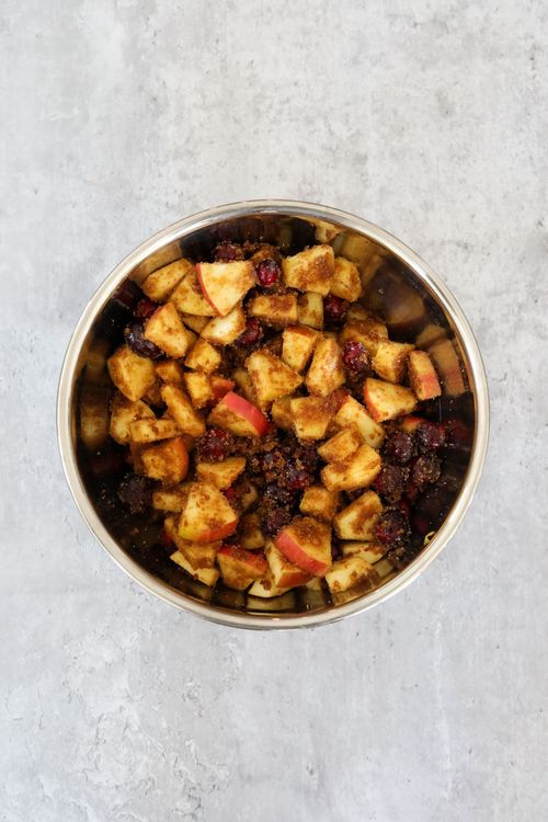 Step 1.2: Toss the apples and cranberries in the sugar mixture gently until evenly coated