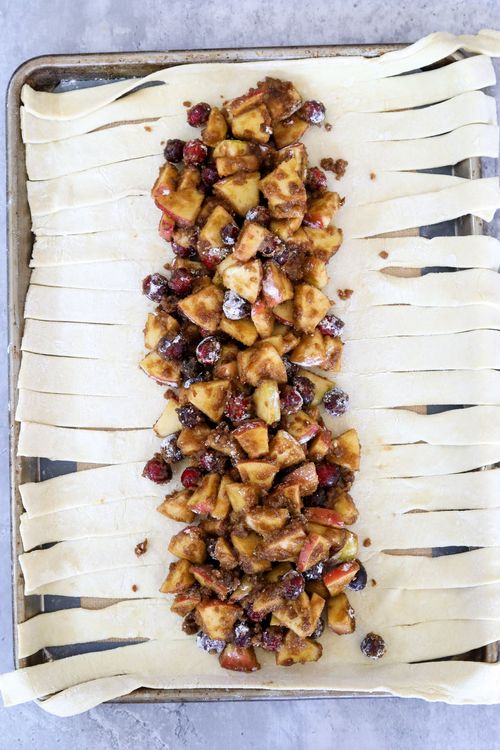 Step 1.1: Remove the puff pastry from the refrigerator and pour the apple and cranberry mixture into a line in the center of the puff pastry along the longest side