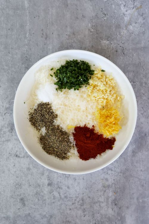 Step 1.1: In a shallow bowl or on a plate, combine the parmesan cheese, garlic, salt, pepper, thyme, paprika, parsley, and lemon zest