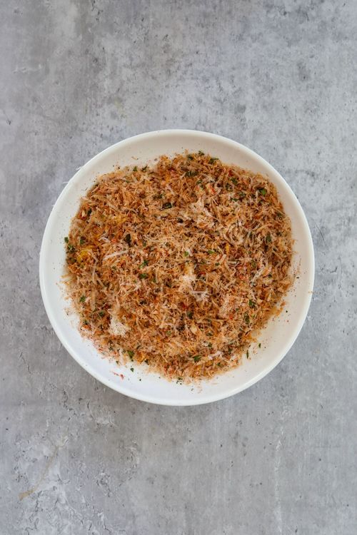 Step 1.2: In a shallow bowl or on a plate, combine the parmesan cheese, garlic, salt, pepper, thyme, paprika, parsley, and lemon zest