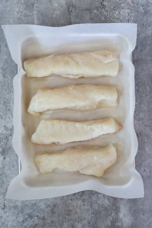 Step 2.1: On another plate, brush all of the halibut fillets with olive oil