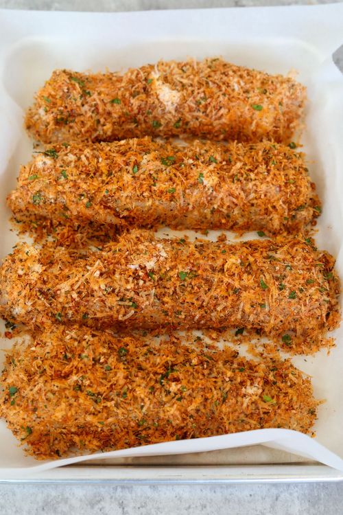Step 2.1: Place the fillets one at a time in the parmesan mixture, making sure to cover all sides, and place on a parchment-lined sheet pan
