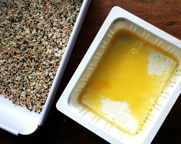 Step 3.1: In a small shallow vessel, beat the egg with 1 tsp water