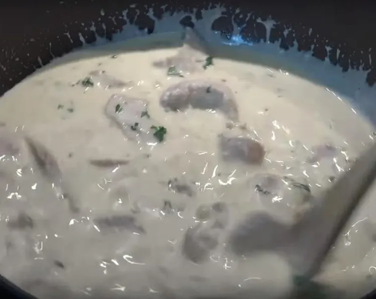 Step 1.1: Pour in the reserved cooking water, Parmesan cheese, fresh parsley, and the cooked chicken
