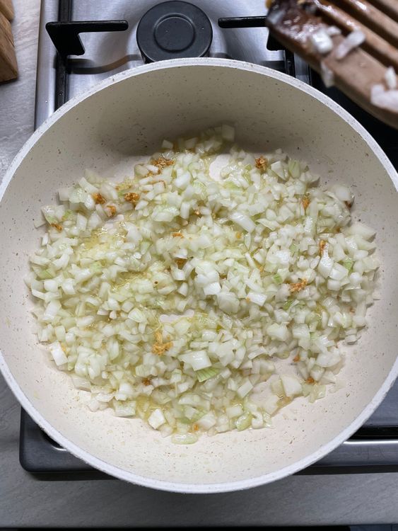 Step 1.1: In a large pan, heat olive oil and sauté the garlic and onions until they are translucent