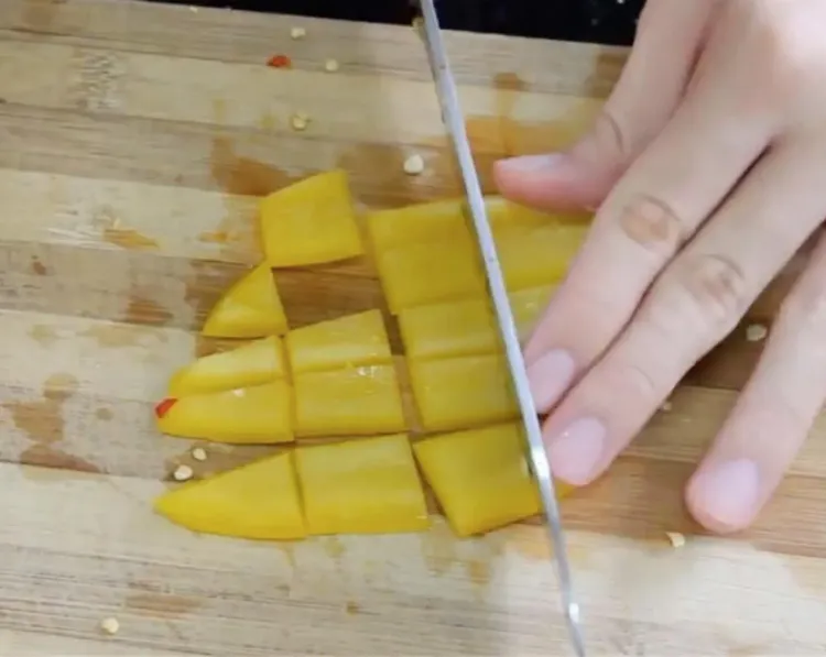 Step 1.1: Chop the yellow bell peppers into cubes