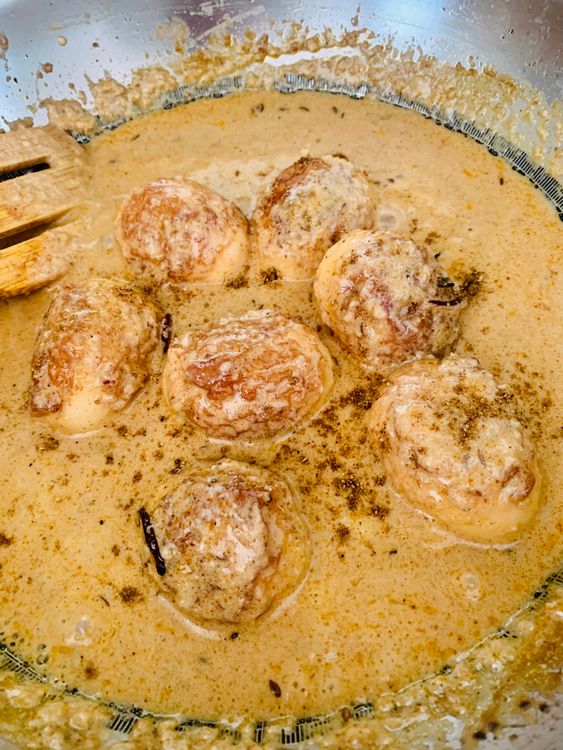 Step 1.1: Transfer the korma to a serving bowl, and garnish with fried onions and garam masala