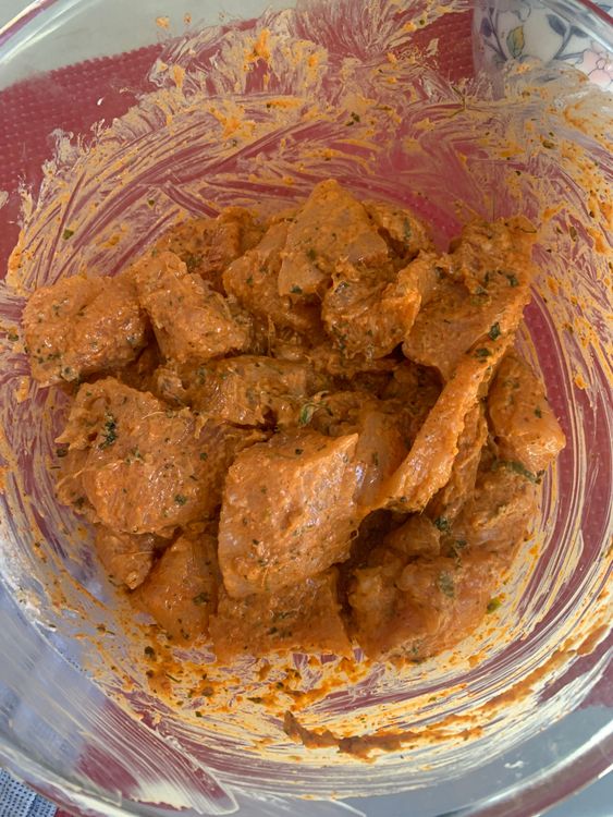 Step 1.2: Add the ginger-garlic-chilli paste to the chicken, followed by salt, Kashmiri red chilli powder, cumin powder, baking powder, kasuri methi, chopped curry leaves, [hung curd](https://www