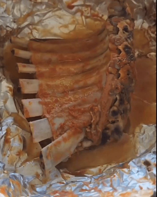 Step 3.1: After 2 hours, remove the ribs from the oven and carefully unwrap them