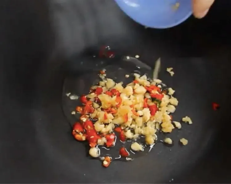 Step 2.1: In a wok, heat oil on medium-high heat