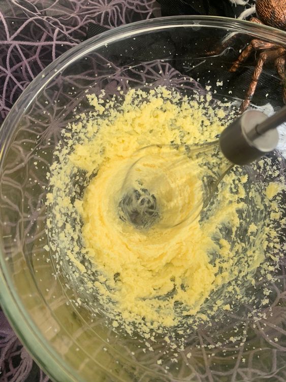 Step 1.1: In a large bowl, cream the softened butter and powdered sugar until light