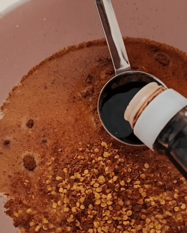 Step 3.1: Stir in the chili flakes, crushed ginger, crushed garlic, fish sauce (or soy sauce), and chicken stock cube (if using) until well combined