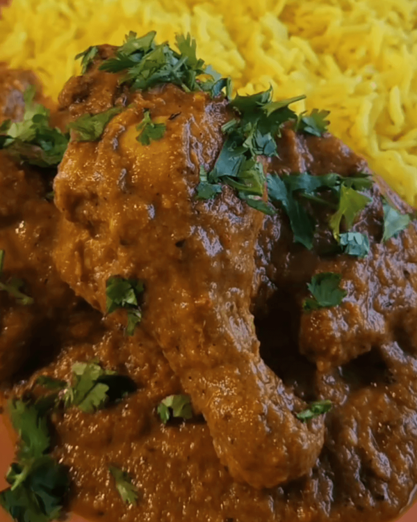 Step 4.1: Serve the spicy grilled chicken over a bed of turmeric rice, with extra sauce on the side if desired