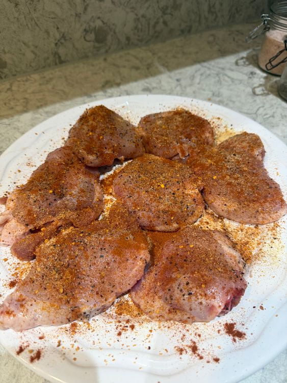 Step 1.1: Place chicken thighs into a bowl or plate and season both sides with salt, pepper, garlic powder, peri peri seasoning, and oil