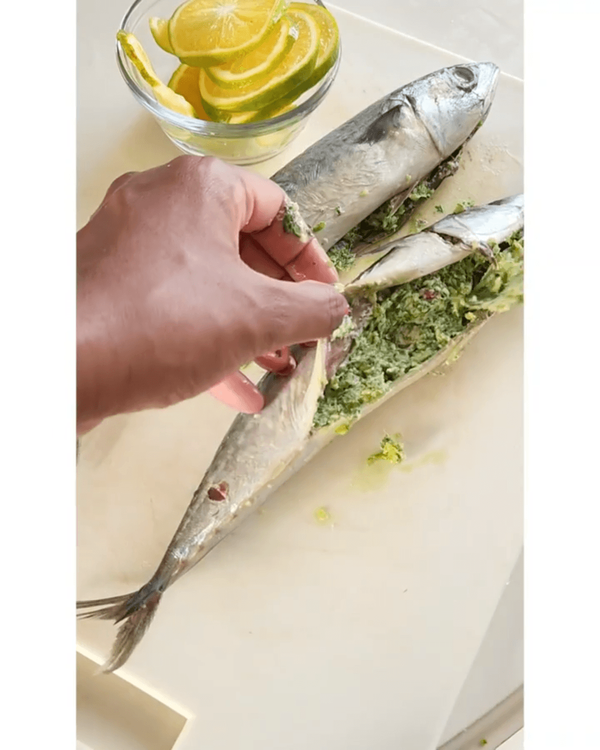 Step 3.1: Stuff mackerel with the butter pesto and add orange slices