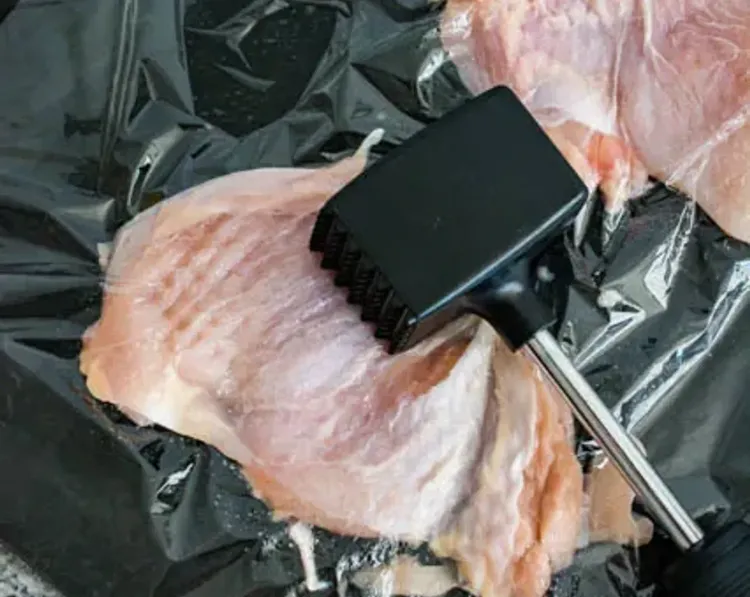 Step 1.1: Place the chicken on a large cutting board, cover with plastic wrap, then pound with a meat tenderizer until the chicken is approximately 1/2-inch thick