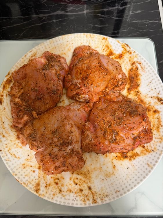 Step 1.1: Season the chicken thighs with paprika, cajun seasoning, chicken seasoning, garlic powder, black pepper, salt, and oil