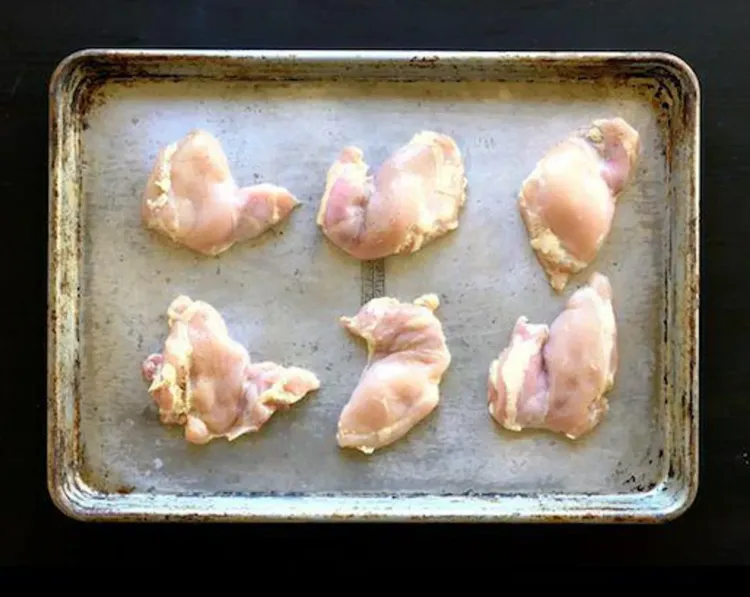 Step 2.1: Toss the boneless, skinless chicken thighs in olive oil and season with salt and ground black pepper