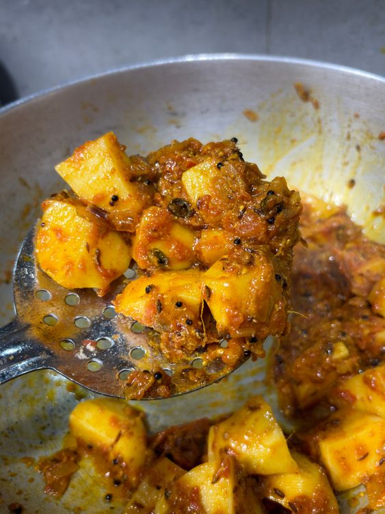 Step 3.2: Add the cubed potatoes, mix well, cover, and cook on medium-low heat for about 5 minutes, stirring once